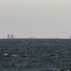 Strait of Hormuz closed again, Iran says, as ships attacked